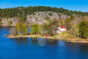 Swedish rural landscape, coastal view with white wooden house