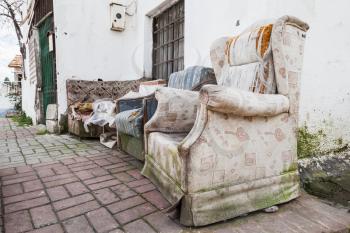 Old abandoned furniture on narrow street of Izmir, Turkey