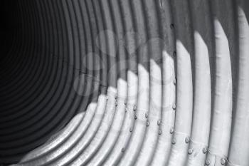Abstract steel tunnel interior fragment, corrugated vaults background