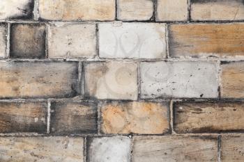 Old yellow white brick wall, close-up background photo texture