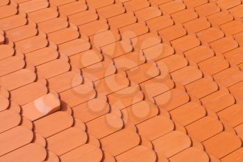 New red roof tiling, close-up background photo texture