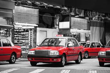 Taxis on the street in Hong Kong. Over 90% daily travelers use public transport, its the highest rank in the world.