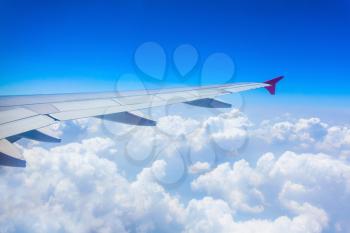 Airplane wing on the blue sky background
