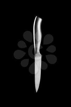 Kitchen knife isolated on black