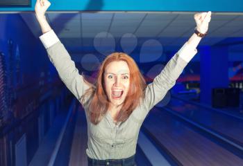Portrait of excited girl in a bowling alley