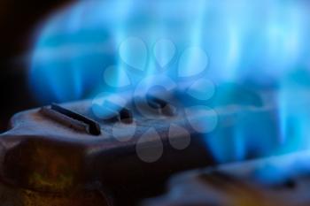 Close-up view of blue flames in gas boiler