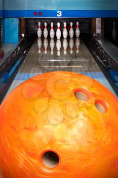 Ten bowling pins at the end of alley