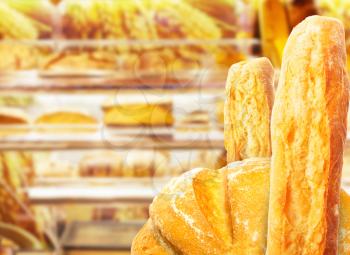 Fresh pastries lies on store shelves. Close-up photo.