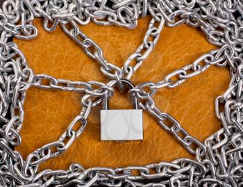 Macro view of padlock and chains