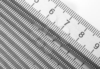 Closeup of white wooden rulers