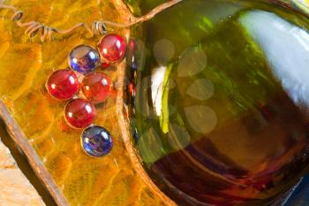 Stained glass composition of wine bottle and vine