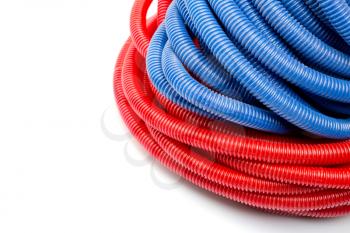 Closeup view of long red and blue water pipes. Isolated