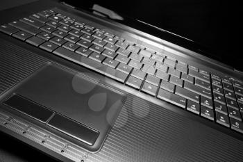 Close-up of modern laptop. In B/W