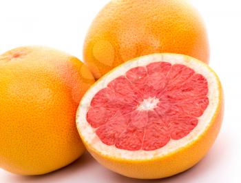 set of three grapefruits on white