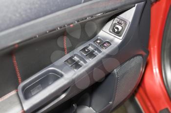 Car interior. Door with handle and buttons