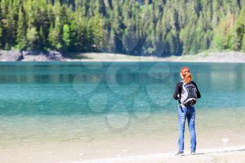 Woman with backpack on the lake, Durmitor National Park, Montenegro