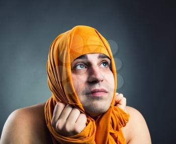 Funny man weared yellow textile on head