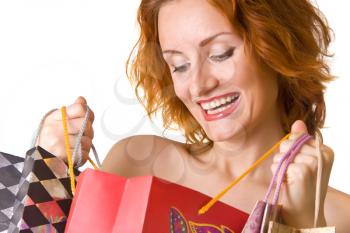 Great shopping. Smiling woman looking into the bag