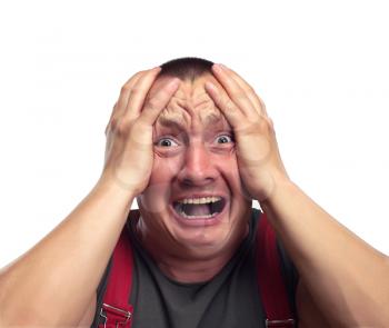 Portrait of screaming surprised man holding head isolated on white