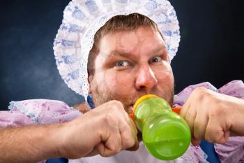 Crazy man sucking baby bottle