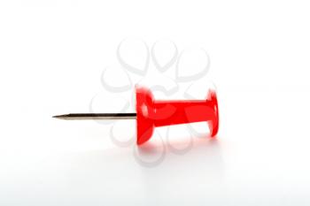 Red push-pins closeup isolated on white background