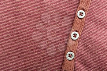 Brown cardigan background with three buttons