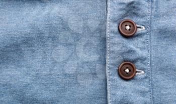 Closeup of jeans with buttons in a row