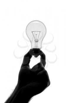 Silhouette of hand holding bulb. Isolated on white