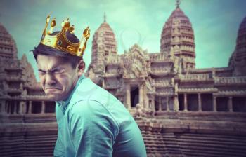 Portrait of a crying prince against asian temple