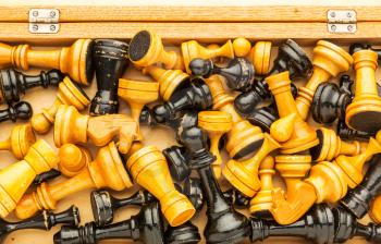 Up view of wooden chess figures in the box 