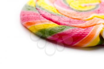 Macro of colorful sweet lollipop isolated on white background