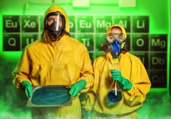 Man and woman in protective suits cooking methamphetamine in the lab