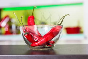 Pods of pepper in glass plate in the kitchen