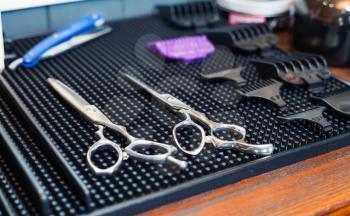 Close up of modern barber's tools on the table