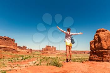 Young traveler look at monument valley. Blue sky on the background