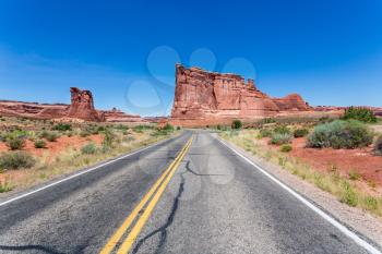 Road to sandstone with skyline, located at Arches National Park, Utah, USA.