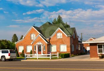 Travel village house and road against blue sky background.