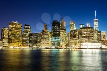 Illuminated manhattan view from hudson at night time, New York City USA