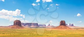 Scenic sandstones and blue cloudy sky at Monument Valley National Tribal Park, Navajo, Utah USA