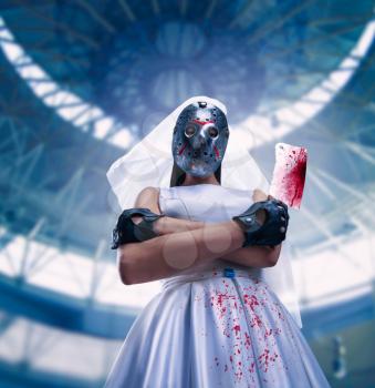 Serial murederer in wedding dress with bloody meat cleaver. Bride in hockey mask