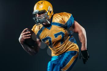 American football offensive player, national league, black background. Contact sport