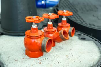 Red valves closeup, new pressure controllers. Plumbing, engineering equipment