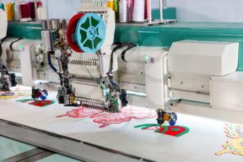 Sewing machine on textile fabric, nobody. Factory production, sew manufacturing, needlework technology