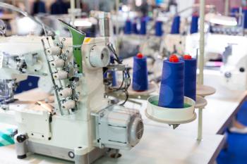 Sewing machine and cloth, nobody, clothing factory. Fabric production, sew manufacturing, needlework technology