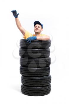 Car tire service, repairman hand up, white background, garage worker with tyres, wheel mounting