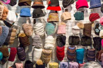 Showcase in women hat shop, fabric textile, colorful headwears