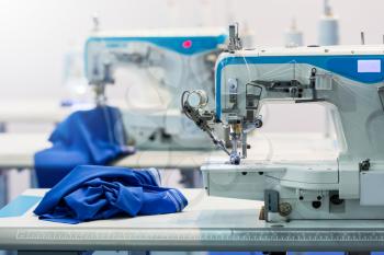Sewing machines, nobody, cloth industry. Factory production, sew manufacturing Clothing fabric