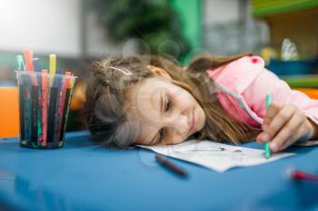Little girl asleep on playground in the shop