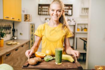 Female person holding a tray with cocktail, fruits and vegetables, cooking organic food. Vegetarian diet, healthy lifestyle concept