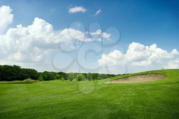 Two balls on golf course, nobody. Green meadow in sport club, trimmed lawn for game, playground